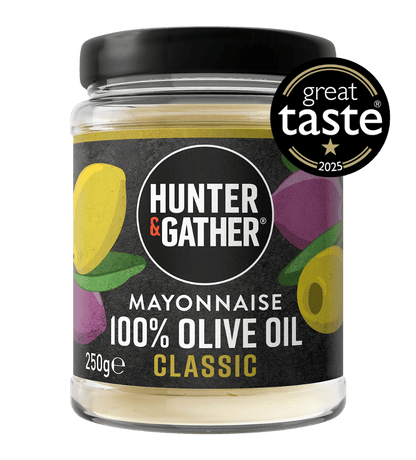 Jar of Hunter & Gather mayonnaise with 100% olive oil on a green background, featuring the Great Taste award logo.