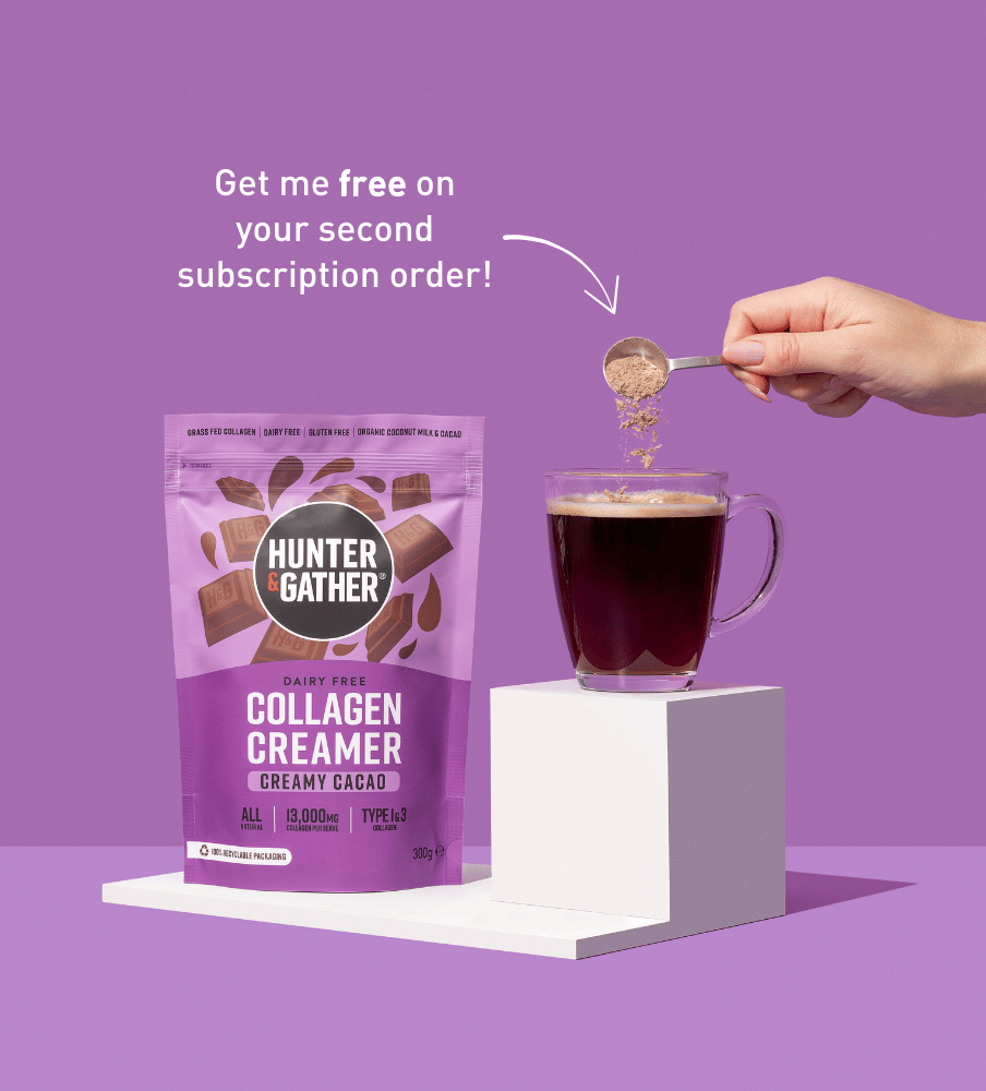 gb-en | Hunter and Gather Collagen Creamer package with a hand pouring it into a cup of tea on a purple background.