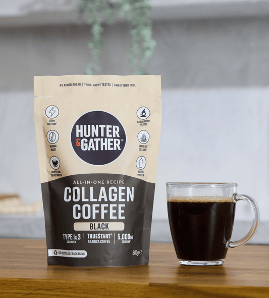 Hunter & Gather collagen coffee package with a glass of coffee on a wooden surface.