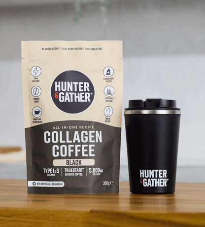 Hunter & Gather collagen coffee package and black travel mug on a wooden surface.
