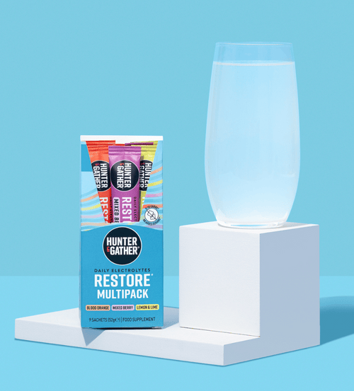 restore electrolytes 9 pack with glass of electrolyte water