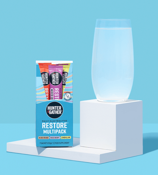 restore electrolytes 9 pack with glass of electrolyte water