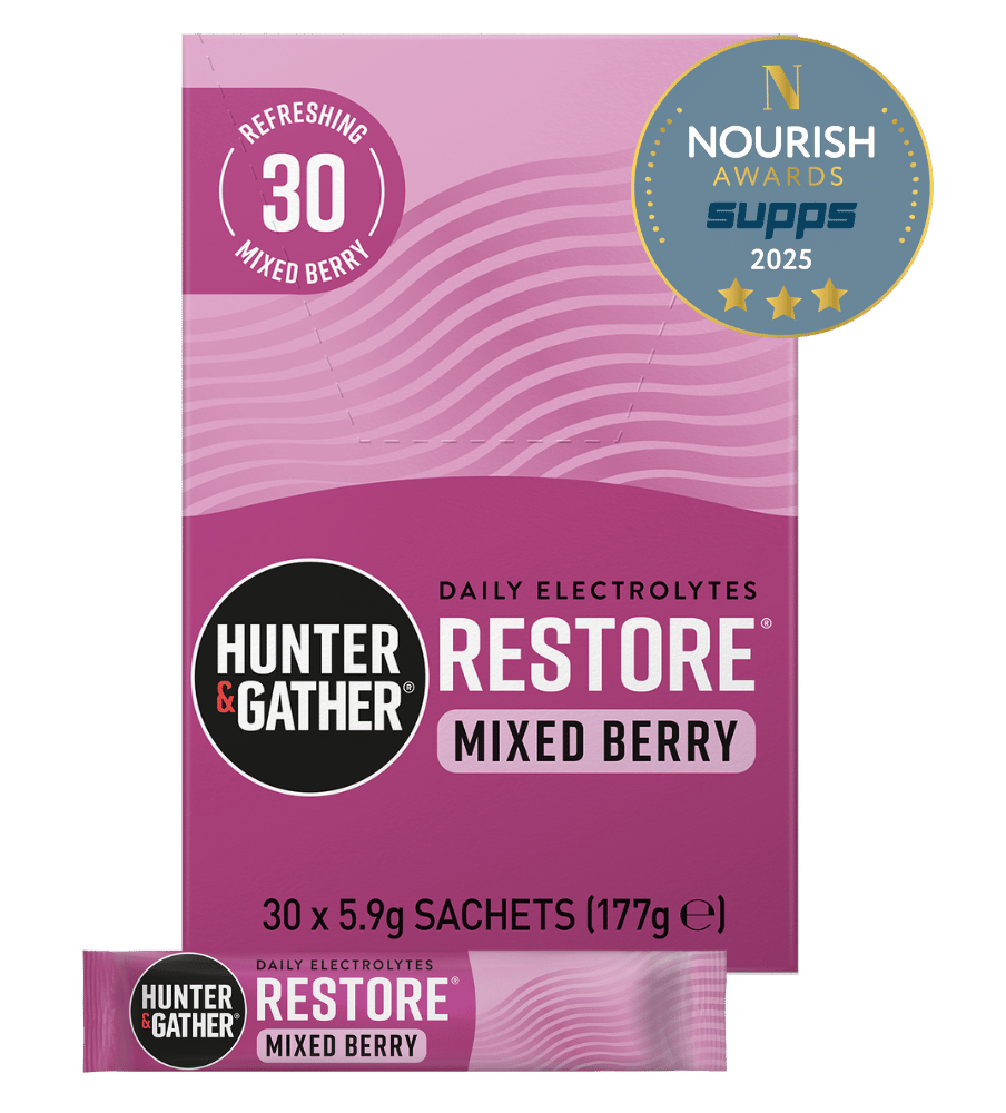 Purple package of Hunter & Gather Restore Mixed Berry electrolyte supplement with Nourish Awards badge on a green background
