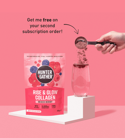 gb-en | Hunter and Gather Rise & Glow Collagen package with a hand pouring powder into a glass on a pink background.