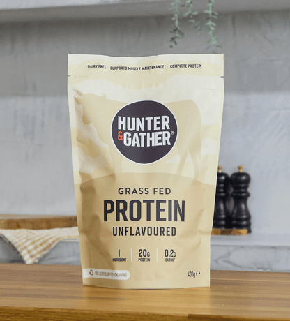 Hunter & Gather protein package on a wooden surface with a neutral background